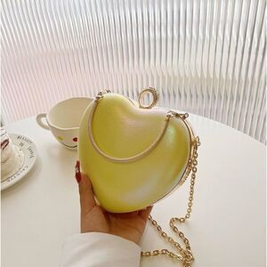 Yellow iridescent heart-shaped purse handbag